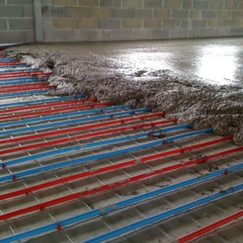 underfloor heating system being finished with concrete