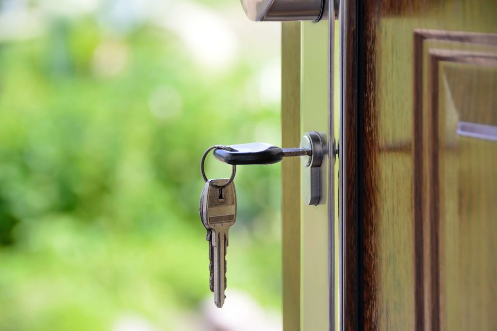 house keys in front door lock