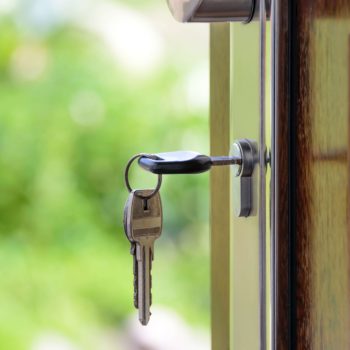 house keys in front door lock