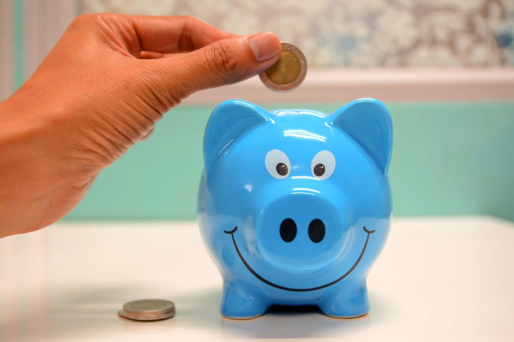 saving money in a piggy bank