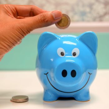 saving money in a piggy bank