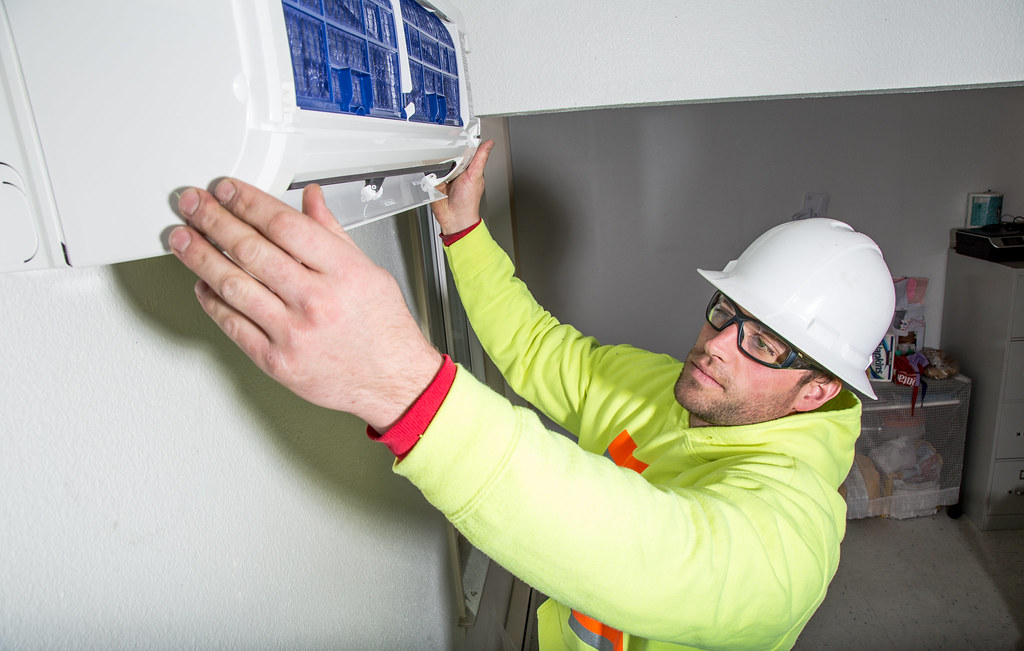worker installing heating prevent heat loss