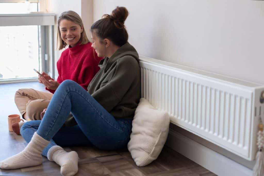 wall heaters women sat next to