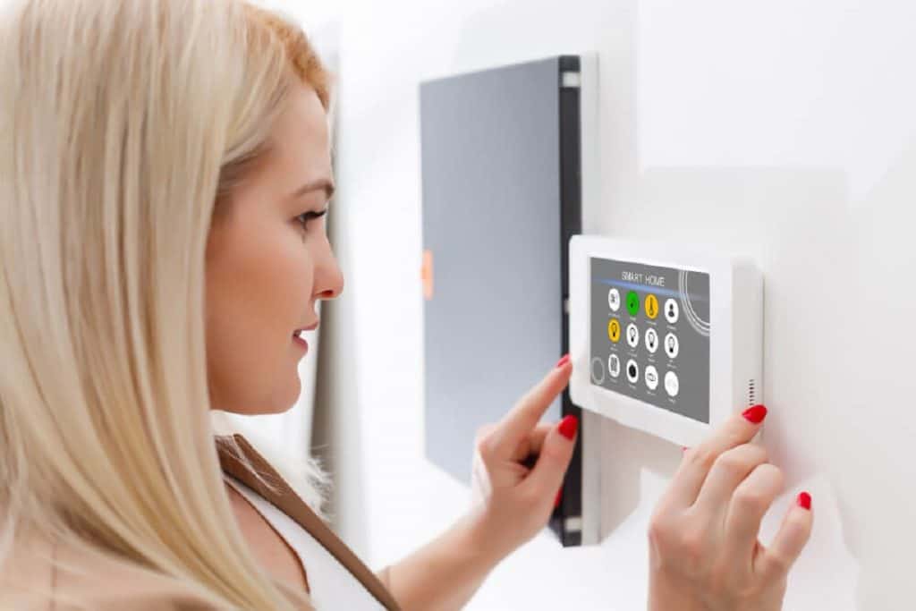 woman controlling multi zone heating