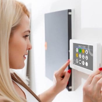 woman controlling multi zone heating