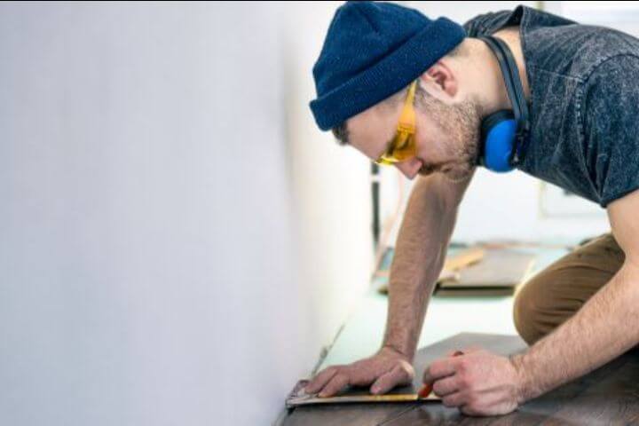 worker making repairs on floors